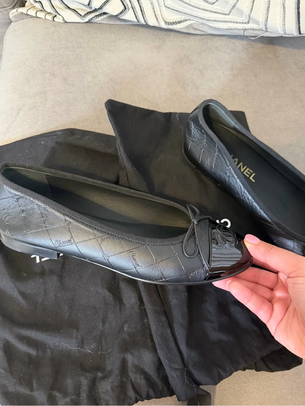 CHANEL Black Quilted Leather Cap-Toe Bow Ballet Flats